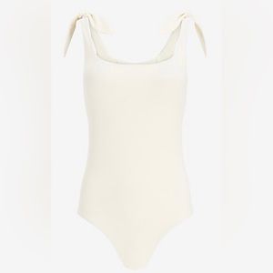 White one piece swim suit bow detail